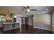 Open concept kitchen with stainless steel appliances and a gray island at 905 Hickory Ridge Sw Rd, Lilburn, GA 30047