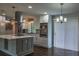 Modern kitchen featuring stainless appliances, a barn door, and plenty of natural light at 905 Hickory Ridge Sw Rd, Lilburn, GA 30047