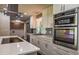 Modern kitchen with stainless steel appliances and white cabinets at 905 Hickory Ridge Sw Rd, Lilburn, GA 30047