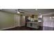 Open concept kitchen with stainless steel appliances and a gray island at 905 Hickory Ridge Sw Rd, Lilburn, GA 30047