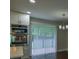 Modern kitchen with stainless steel appliances and white cabinets at 905 Hickory Ridge Sw Rd, Lilburn, GA 30047