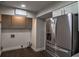 This laundry room features new stainless steel appliances and ample cabinet storage space at 905 Hickory Ridge Sw Rd, Lilburn, GA 30047
