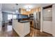 Modern kitchen with stainless steel appliances, breakfast bar, and adjacent to living area at 2232 Dunseath Nw Ave # 309, Atlanta, GA 30318