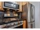 Kitchen with stainless steel appliances including range, microwave, and refrigerator at 2232 Dunseath Nw Ave # 309, Atlanta, GA 30318