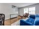 Living room with hardwood floors, comfortable sofa, and natural light at 2232 Dunseath Nw Ave # 309, Atlanta, GA 30318