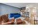 Comfortable living room with a modern sofa, hardwood floors, and open to the kitchen at 2232 Dunseath Nw Ave # 309, Atlanta, GA 30318