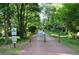 Walking path is surrounded by lush trees and plants, an ideal spot for a stroll at 2232 Dunseath Nw Ave # 309, Atlanta, GA 30318