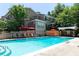 Community pool with lounge chairs and umbrellas for residents at 2232 Dunseath Nw Ave # 309, Atlanta, GA 30318