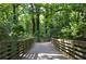 Wooded walkway for an enjoyable view of mature trees and plants at 2232 Dunseath Nw Ave # 309, Atlanta, GA 30318