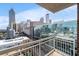 A view from the balcony shows Atlanta's impressive skyline, highlighting unique architectural styles at 285 Centennial Olympic Park Nw Dr # 1407, Atlanta, GA 30313