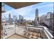 Balcony overlooking Atlanta, providing views of local buildings, apartments, and parking spaces at 285 Centennial Olympic Park Nw Dr # 1407, Atlanta, GA 30313