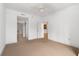 Neutral bedroom shows off a door to the kitchen, another leading to the bathroom, and wall-to-wall carpeting at 285 Centennial Olympic Park Nw Dr # 1407, Atlanta, GA 30313