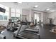 Community fitness center featuring treadmills, weights, and other exercise machines at 285 Centennial Olympic Park Nw Dr # 1407, Atlanta, GA 30313