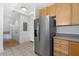 Spacious kitchen with stainless steel refrigerator, offering plenty of room for groceries and supplies at 285 Centennial Olympic Park Nw Dr # 1407, Atlanta, GA 30313