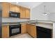 Functional kitchen with a microwave, oven, dishwasher, and ample storage space at 285 Centennial Olympic Park Nw Dr # 1407, Atlanta, GA 30313
