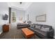 The open-concept living room and bedroom features large windows with city views and a sleek, modern design at 285 Centennial Olympic Park Nw Dr # 1407, Atlanta, GA 30313