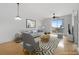 Inviting living room with modern decor, stylish furnishings, and a balcony overlooking the city at 285 Centennial Olympic Park Nw Dr # 1407, Atlanta, GA 30313