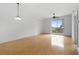 Bright living room with gleaming hardwood floors and natural light pouring in from the balcony at 285 Centennial Olympic Park Nw Dr # 1407, Atlanta, GA 30313