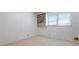 Bright bedroom with carpet and a large window with built in shelving, perfect for storage at 784 San Miguel Dr, Stone Mountain, GA 30083