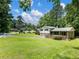 Charming two-story house with a lush lawn and mature trees at 784 San Miguel Dr, Stone Mountain, GA 30083