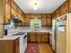 Well-lit kitchen featuring wood cabinetry and white countertops, offering a functional space at 784 San Miguel Dr, Stone Mountain, GA 30083