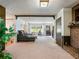 Cozy living room featuring a brick fireplace and an inviting view to the front yard at 784 San Miguel Dr, Stone Mountain, GA 30083