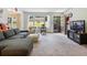Spacious living room with plush carpet, ample natural light, and neutral decor at 784 San Miguel Dr, Stone Mountain, GA 30083
