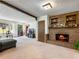 Cozy living room featuring a classic brick fireplace, with warm and inviting decor at 784 San Miguel Dr, Stone Mountain, GA 30083