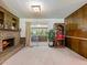 Relaxing living room area with a fireplace and access to an enclosed porch with natural light at 784 San Miguel Dr, Stone Mountain, GA 30083