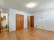 Large main bedroom with hardwood style floors, closet and en-suite bathroom at 784 San Miguel Dr, Stone Mountain, GA 30083