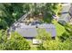 Aerial view of the house showing the roof, driveway, and surrounding trees at 3008 Ridgeside Ct, Atlanta, GA 30341