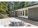 Backyard view of the home featuring a concrete patio and access to the yard at 3008 Ridgeside Ct, Atlanta, GA 30341