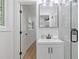 Modern bathroom featuring a sleek vanity, black hardware, and glass-enclosed shower at 3008 Ridgeside Ct, Atlanta, GA 30341