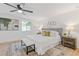 Bright bedroom with a ceiling fan, neutral decor, and a bench at the foot of the bed at 3008 Ridgeside Ct, Atlanta, GA 30341