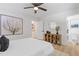 Clean bedroom features a ceiling fan, decor art, and an entrance to the bathroom at 3008 Ridgeside Ct, Atlanta, GA 30341