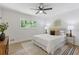 Sunny bedroom with decor art, ceiling fan, an area rug and natural light from a window at 3008 Ridgeside Ct, Atlanta, GA 30341