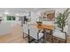 Light-filled dining area with a modern table and chairs, plus luxury vinyl flooring at 3008 Ridgeside Ct, Atlanta, GA 30341