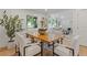 Bright dining area next to the living room with a modern table and chairs at 3008 Ridgeside Ct, Atlanta, GA 30341
