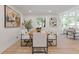 Open-concept dining area with modern decor and luxury vinyl flooring at 3008 Ridgeside Ct, Atlanta, GA 30341