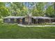 Charming single-story home with painted brick, new roof, and professionally landscaped front yard at 3008 Ridgeside Ct, Atlanta, GA 30341