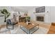 Open floor plan with seamless flow between the living room and kitchen, accented by a cozy fireplace at 3008 Ridgeside Ct, Atlanta, GA 30341