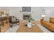 This inviting living room features a stunning fireplace and is adjacent to a modern, open-concept kitchen at 3008 Ridgeside Ct, Atlanta, GA 30341