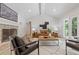 Bright and airy living room with a vaulted ceiling, fireplace, and windows, creating a welcoming and open space at 3008 Ridgeside Ct, Atlanta, GA 30341