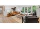 Sun-drenched living room with stylish furniture, contemporary decor, and access to an outdoor patio through French doors at 3008 Ridgeside Ct, Atlanta, GA 30341
