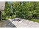 Open patio with wrought iron railing overlooks the lush, wooded backyard at 3008 Ridgeside Ct, Atlanta, GA 30341
