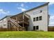 Wide-angle view of the backyard showing the deck, lawn, and perimeter fencing at 4000 Red Canoe Bnd, Lilburn, GA 30047