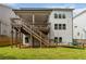 Exterior backyard view showing the wooden deck, green lawn, and surrounding fence at 4000 Red Canoe Bnd, Lilburn, GA 30047