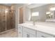 Bright bathroom featuring walk-in shower and white vanity at 4000 Red Canoe Bnd, Lilburn, GA 30047