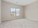 Carpeted bedroom has a window allowing for exterior views at 4000 Red Canoe Bnd, Lilburn, GA 30047