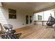 Wooden deck with seating and covered porch at 4000 Red Canoe Bnd, Lilburn, GA 30047